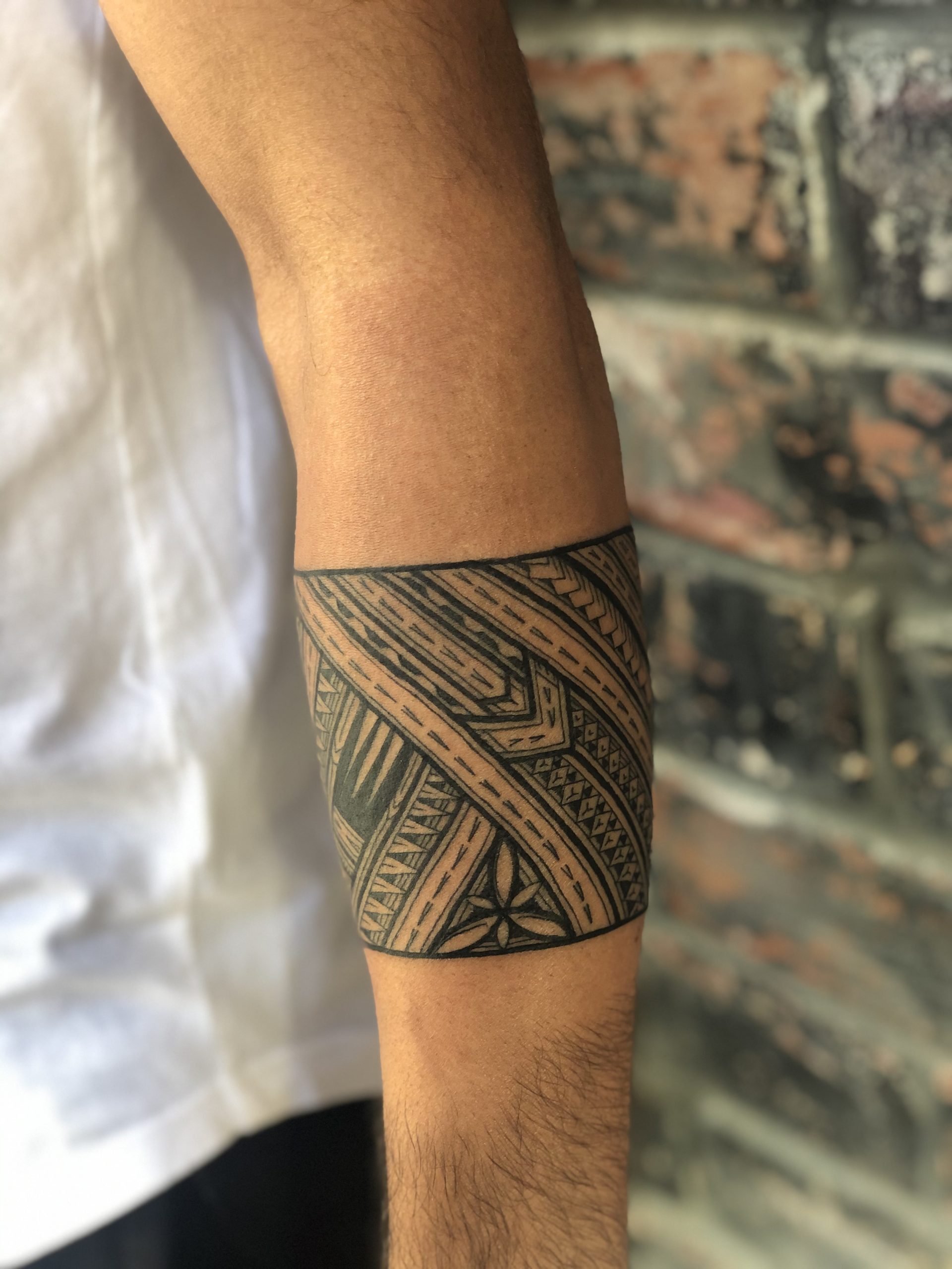 Filipino tribal sleeve with American flag mixed ib tattoo idea | TattoosAI